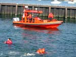 Fire Island CG Sta Crew Members stand watch over the Cadets in their RHIB. Photo by CWO F. Woodward, NSCC